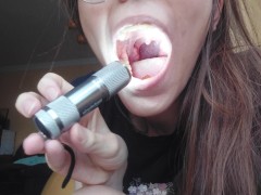 Giantess plays with a tiny in her mouth before swallowing it