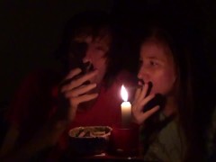 Couple smoking next to candle