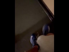 Hotel pee on stairs with people around