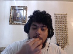 disheveled fat Arab man eats chicken nuggets.