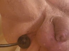 Stretching my cunt with my inflatable plug in the shower.