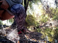 BBW in leggings pissing by the lake in a public park