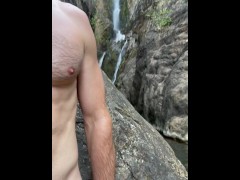 Hairy Muscular Guy Pissing at a Public Waterfall