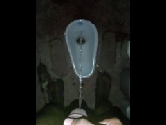 Hard pee challenge in the public toilet. squirt