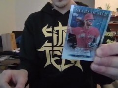 Cute Nerd Opening a Pack of Trading Cards