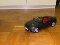 Playing with a BMW M4 cabrio toy car