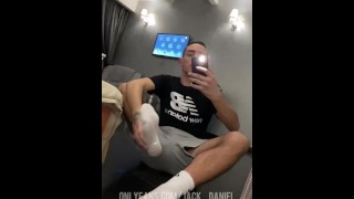 Guy sniffs white Nike socks