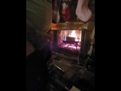 Jerking off next to a warm fire