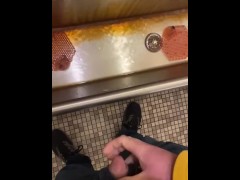 Taking a piss at an old urinal trough