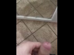 Chubby guy jerking off in front of the mirror and cumming on the floor