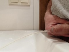 Pissing cock in the bathroom.
