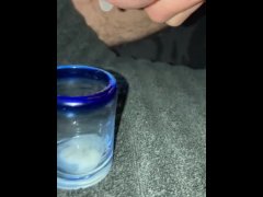 Trying to milk my cum into a shot glass while filming