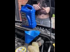 Girl fills oil up in her car and flashes tits