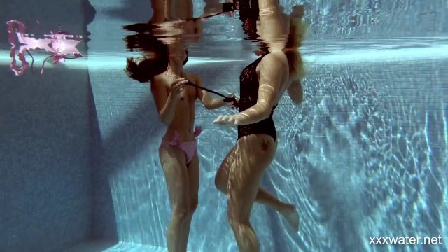 In the indoor pool, two stunning girls swim - Haley Hill, Stefanie Moon, Stephanie Moon