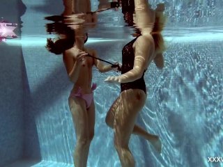 In the Indoor Pool,Two Stunning Girls Swim