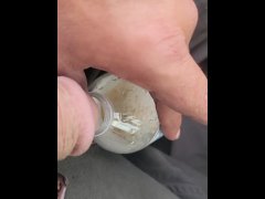 Pissing in bottle in parking lot wit strangers walking by and windows down
