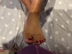 Stroking a bulge with my painted toes and feet