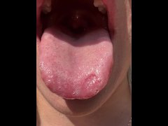 A nice girl shows mouth throat uvual and sloppy wet tongue