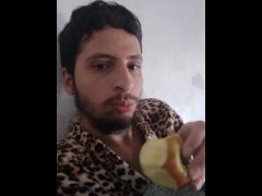 Just a boy resting eating an apple