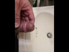 Hairy bear pisses and cums in sink.  Close up
