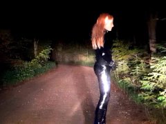 Rubberdoll posting in park at night