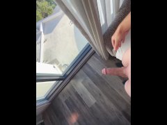 Young guy cums all over window!