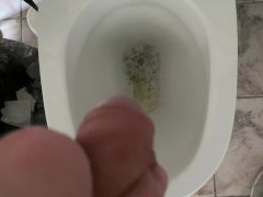 Man pissing in the office toilet